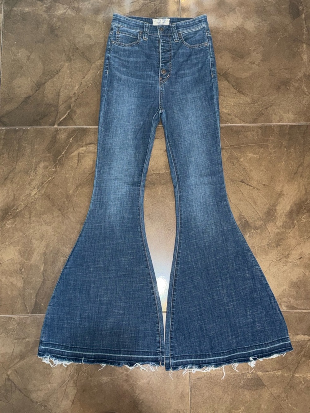 We The Free Dark Blue High-Waist Flared Jeans with Raw Hem